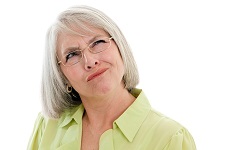 mature woman making a confused face